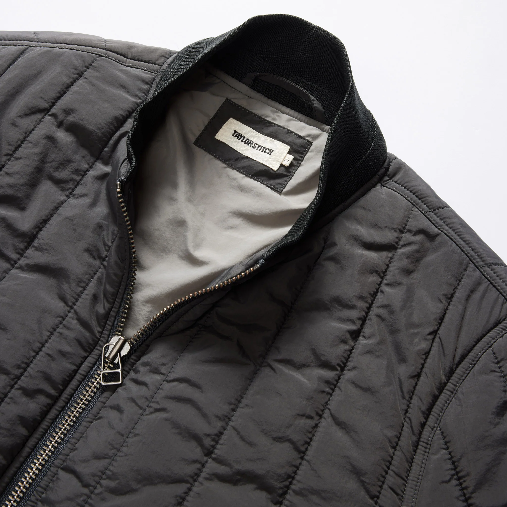 The Able Jacket in Faded Black Quilted Nylon - Image 9